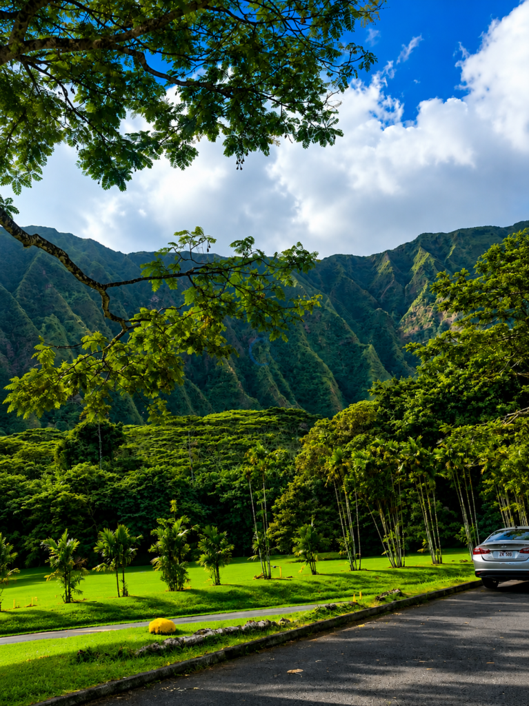 Koolau mountain range framed by trees at a botanical garden