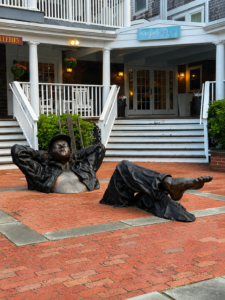 Bronze sunbathing statue sculpture outside Vineyard Square Hotel in Martha's Vineyard